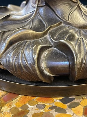Lot 69 - A pair of patinated bronze table lamps