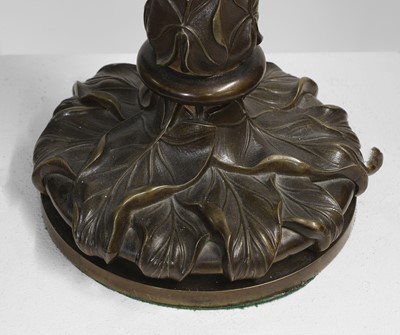 Lot 69 - A pair of patinated bronze table lamps