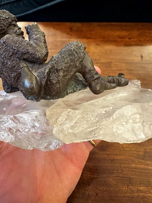 Lot 70 - A bronze figure of a reclining hunter