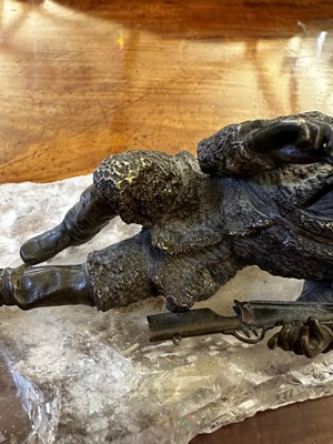 Lot 70 - A bronze figure of a reclining hunter