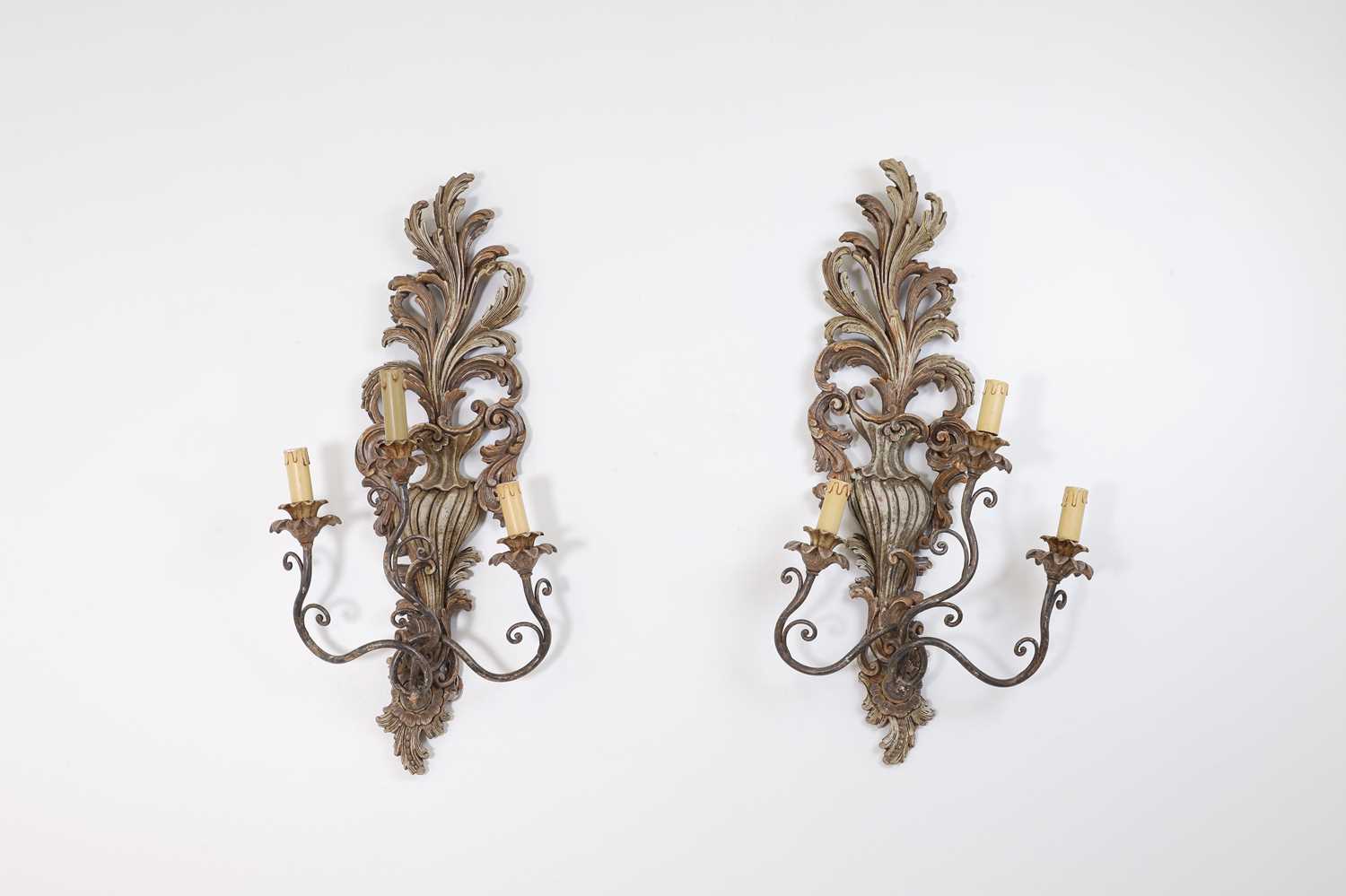 Lot 115 - A pair of carved and painted wood wall lights