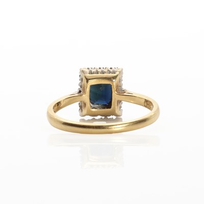 Lot 1155 - An 18ct gold sapphire and diamond cluster ring