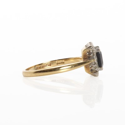 Lot 1155 - An 18ct gold sapphire and diamond cluster ring