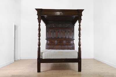 Lot 351 - A carved oak three-quarter tester bed