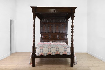 Lot 351 - A carved oak three-quarter tester bed