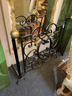 Lot 22 - A cast iron and brass fireguard