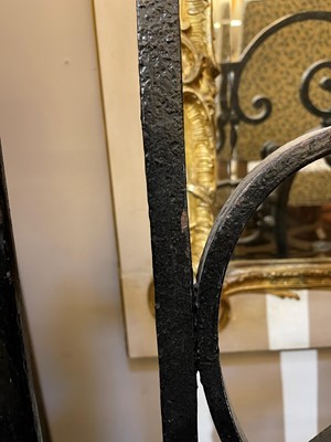 Lot 22 - A cast iron and brass fireguard