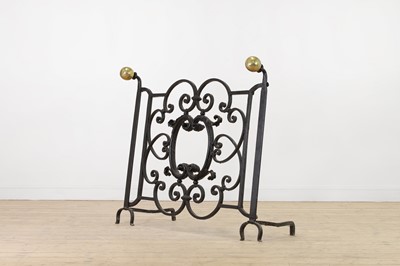 Lot 22 - A cast iron and brass fireguard