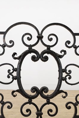 Lot 22 - A cast iron and brass fireguard