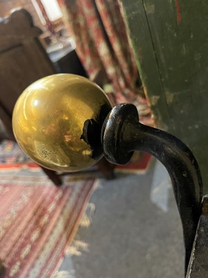 Lot 22 - A cast iron and brass fireguard