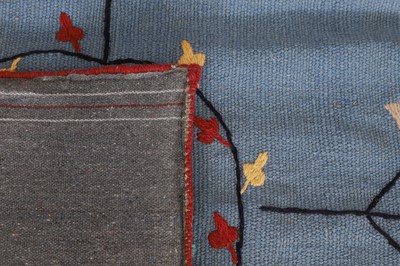 Lot 49 - A suzani-inspired flat-weave rug