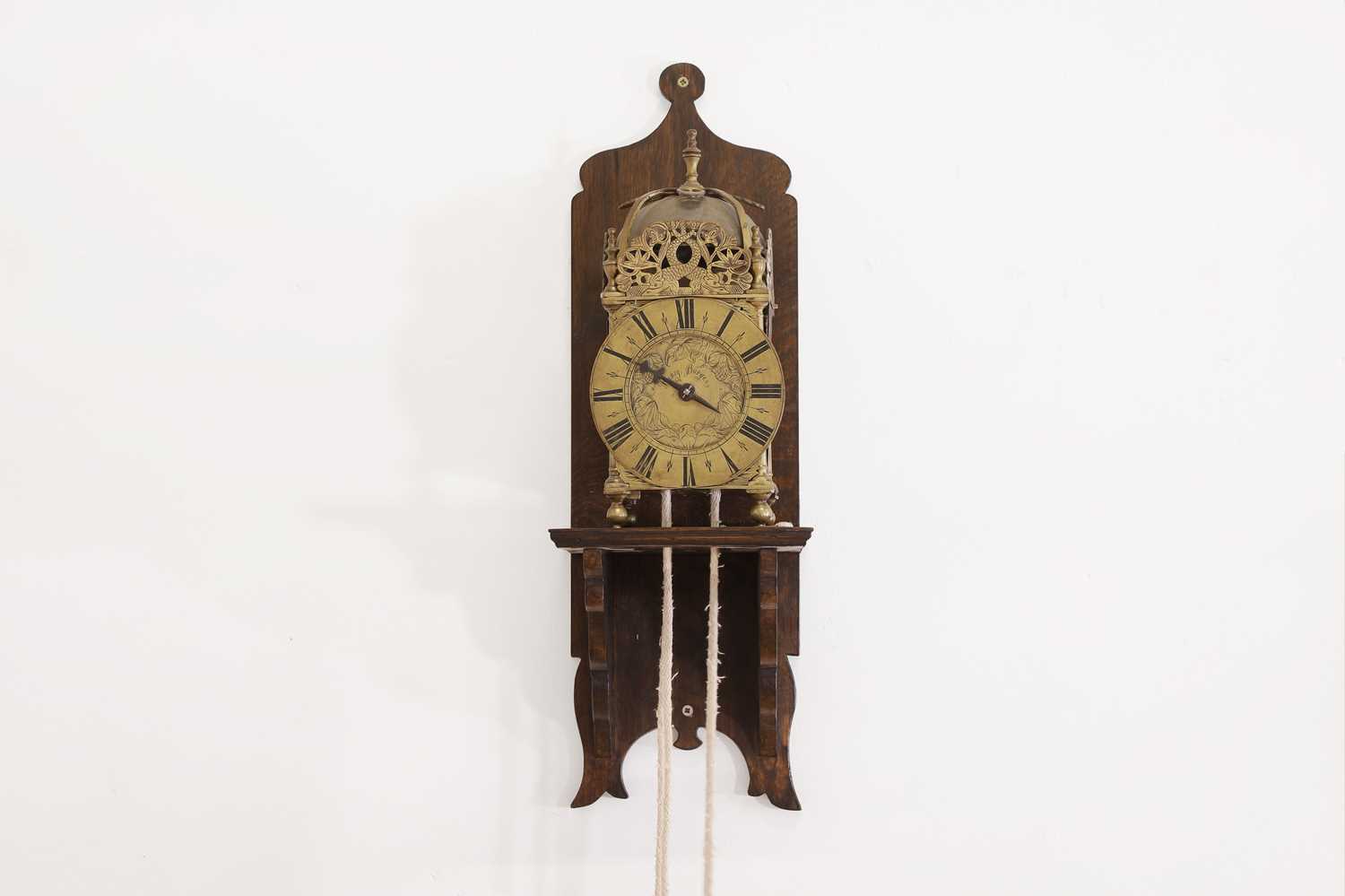Lot 354 - A brass lantern clock