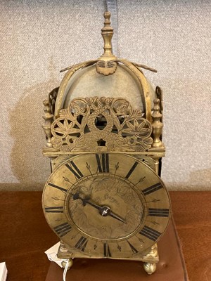 Lot 354 - A brass lantern clock
