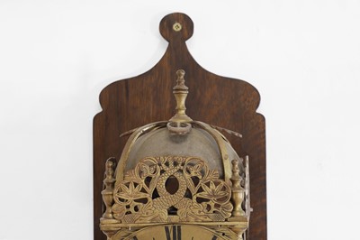 Lot 354 - A brass lantern clock