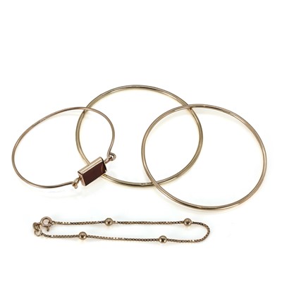 Lot 210 - Three 9ct gold bangles and one 9ct gold bracelet