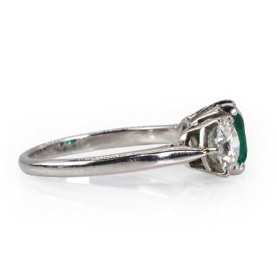 Lot 182 - An emerald and diamond three stone ring