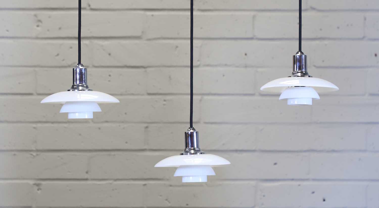 Lot 234 - A set of three Danish 'PH 2/1' pendant lights