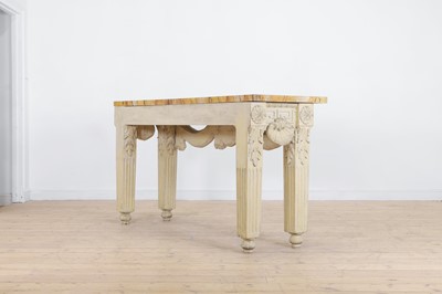 Lot 573 - A George II-style carved and painted pine console table in the manner of William Kent