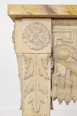 Lot 573 - A George II-style carved and painted pine console table in the manner of William Kent