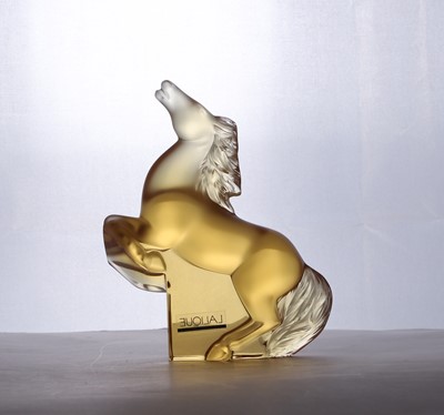 Lot 263 - A Lalique amber glass 'Kazak' horse