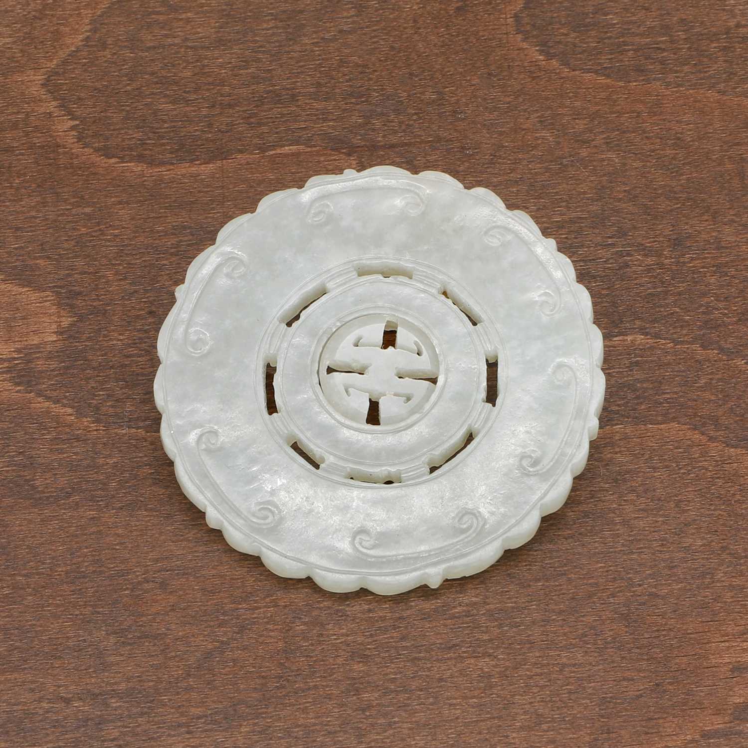 Lot 109 - A Chinese jade pendant