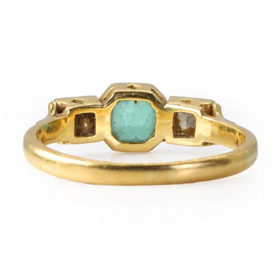 Lot 179 - An 18ct gold emerald and diamond ring