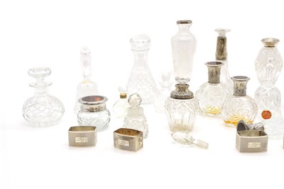 Lot 48 - A group of five silver mounted cut glass bottles