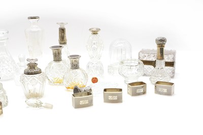 Lot 48 - A group of five silver mounted cut glass bottles