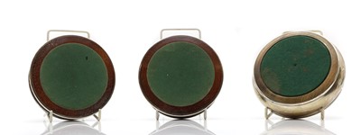 Lot 49 - A pair of silver wine bottle coasters