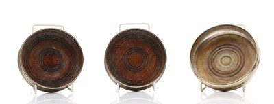 Lot 49 - A pair of silver wine bottle coasters