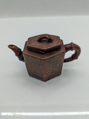 Lot 68 - A collection of four Chinese Yixing stoneware teapots