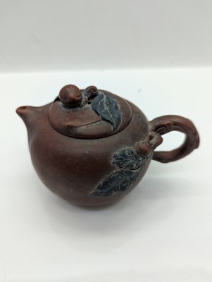 Lot 68 - A collection of four Chinese Yixing stoneware teapots
