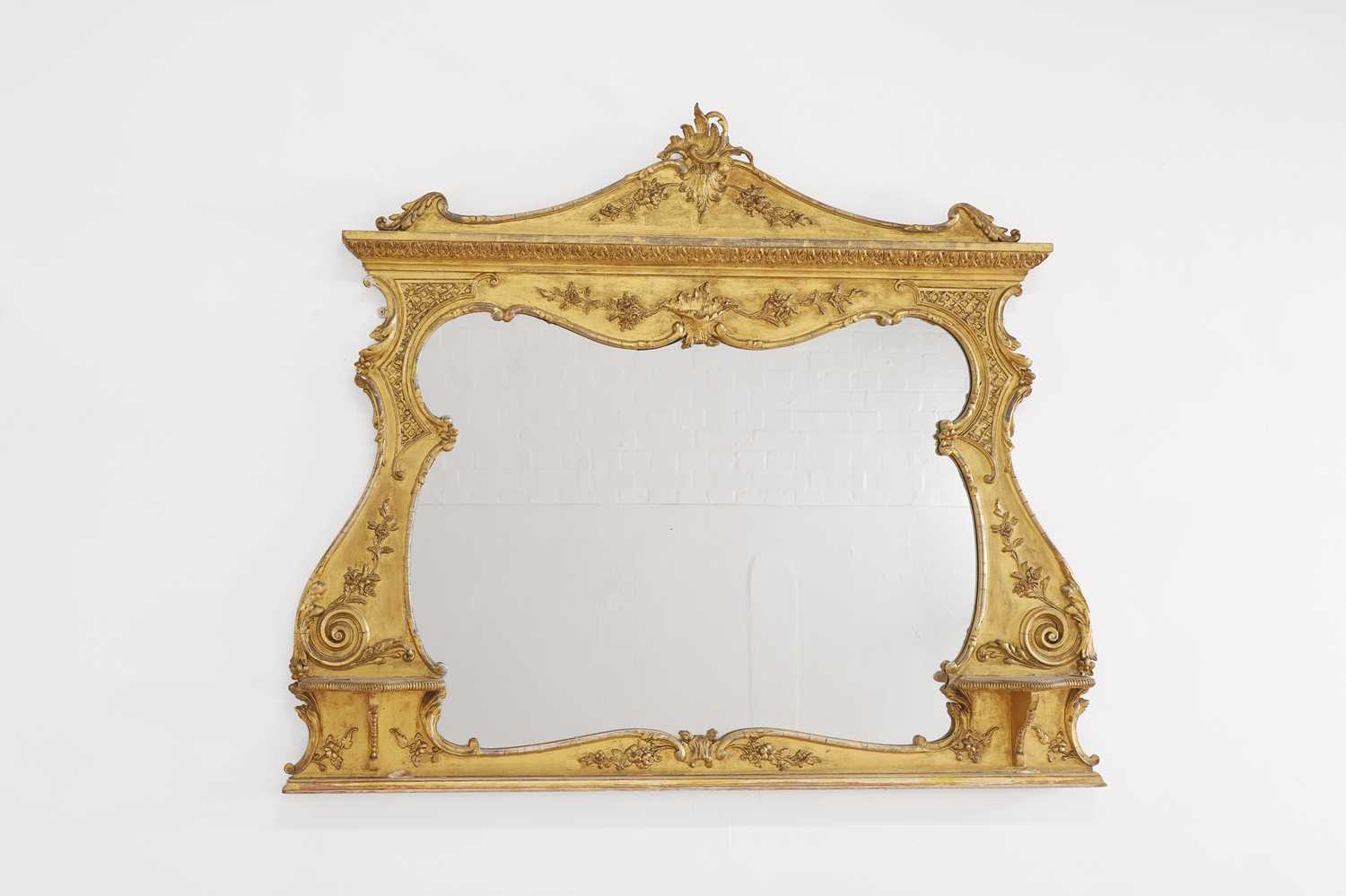 Lot 50 - A George III-style giltwood and gesso overmantel mirror