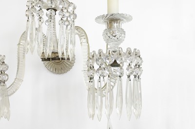 Lot 137 - A set of three cut-glass wall lights