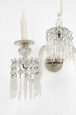 Lot 137 - A set of three cut-glass wall lights