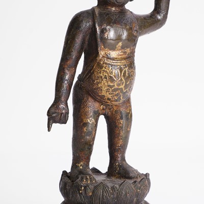 Lot 144 - A Chinese gilt-bronze model of the infant Buddha