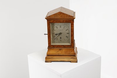 Lot 282 - A walnut library clock