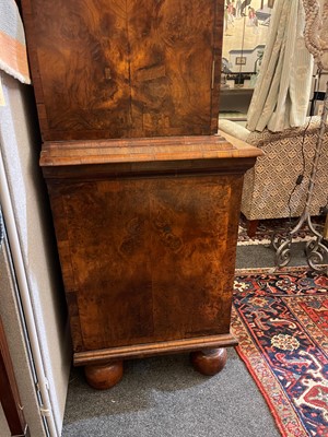 Lot 98 - A walnut cabinet on chest