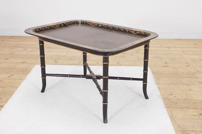 Lot 93 - A papier mâché lacquered tray top table