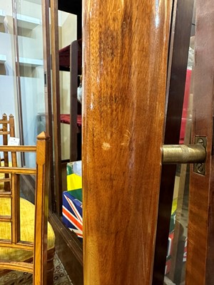Lot 102 - An Empire flame mahogany cheval mirror