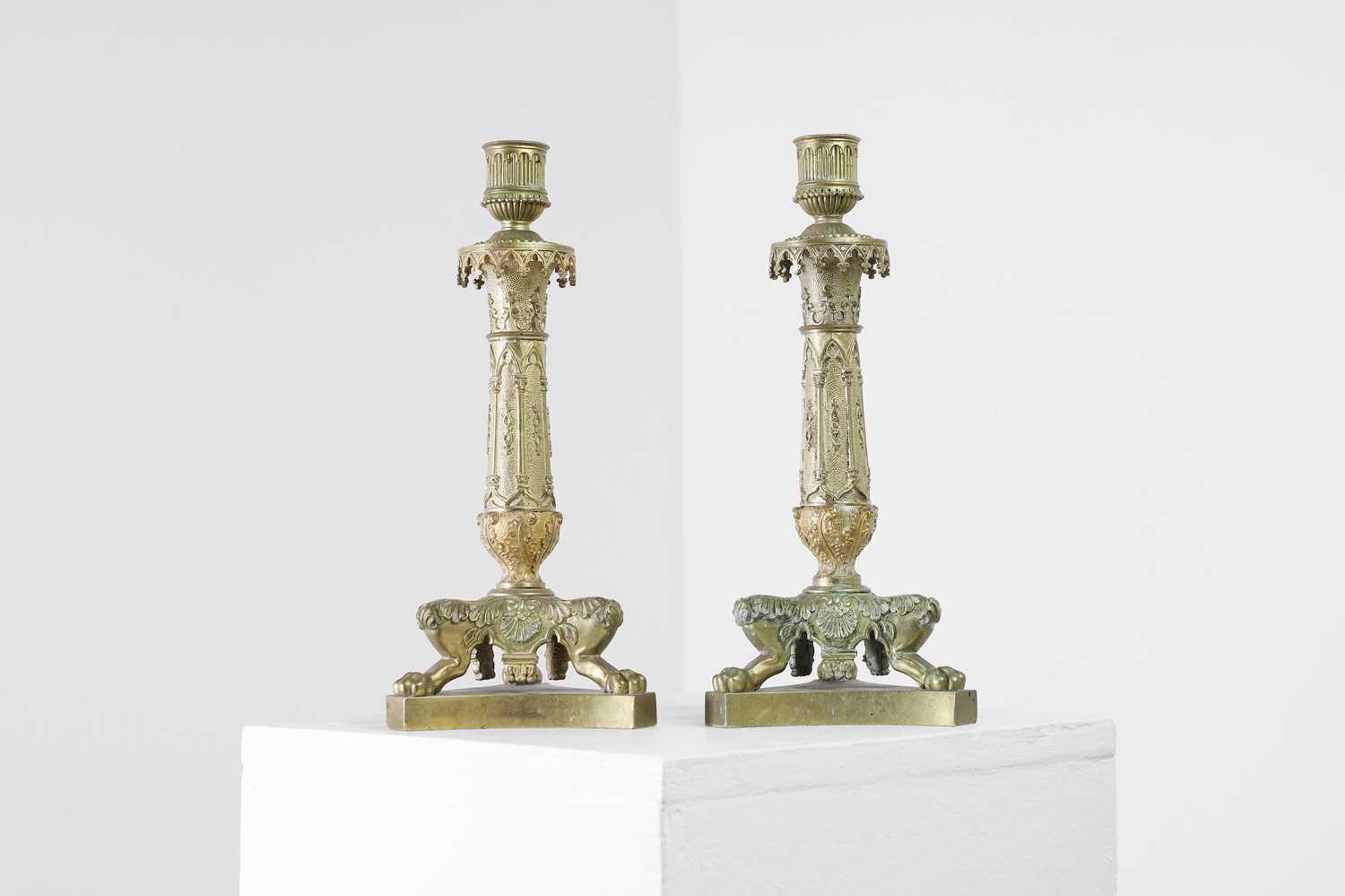 Lot 35 - A pair of George IV brass candlesticks
