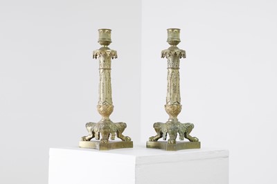 Lot 35 - A pair of George IV brass candlesticks