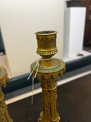 Lot 35 - A pair of George IV brass candlesticks