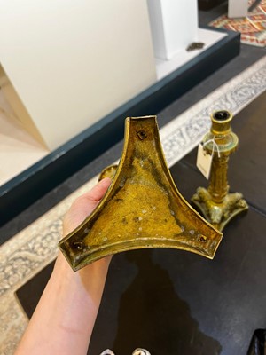 Lot 35 - A pair of George IV brass candlesticks