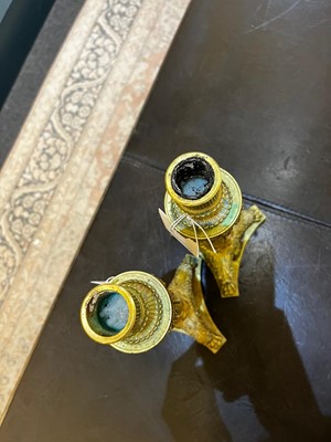 Lot 35 - A pair of George IV brass candlesticks