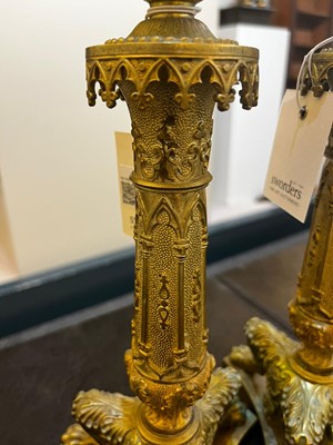 Lot 35 - A pair of George IV brass candlesticks
