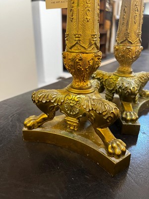 Lot 35 - A pair of George IV brass candlesticks