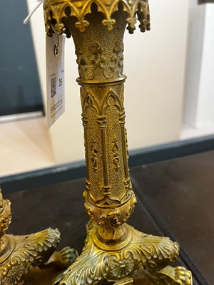 Lot 35 - A pair of George IV brass candlesticks
