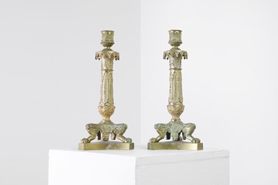 Lot 35 - A pair of George IV brass candlesticks