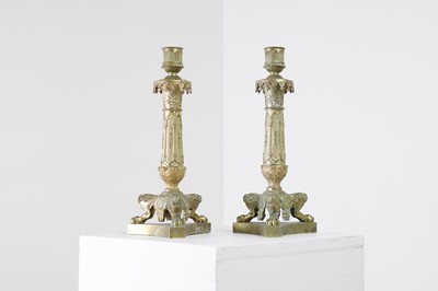 Lot 35 - A pair of George IV brass candlesticks